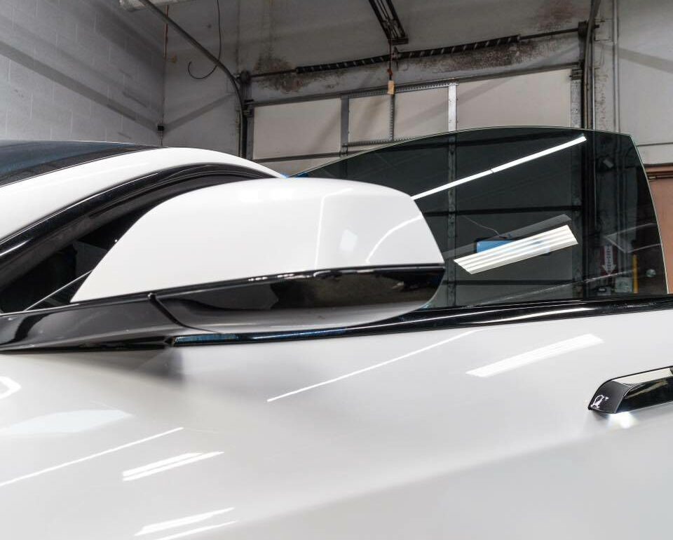 picture of white Tesla with window tint